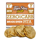 A package of Thin Slim Foods Zero Net Carb Brick Oven Pita, featuring five round, lightly toasted pitas in front of a colorful label highlighting its keto-friendly, sugar-free, and high-protein attributes.